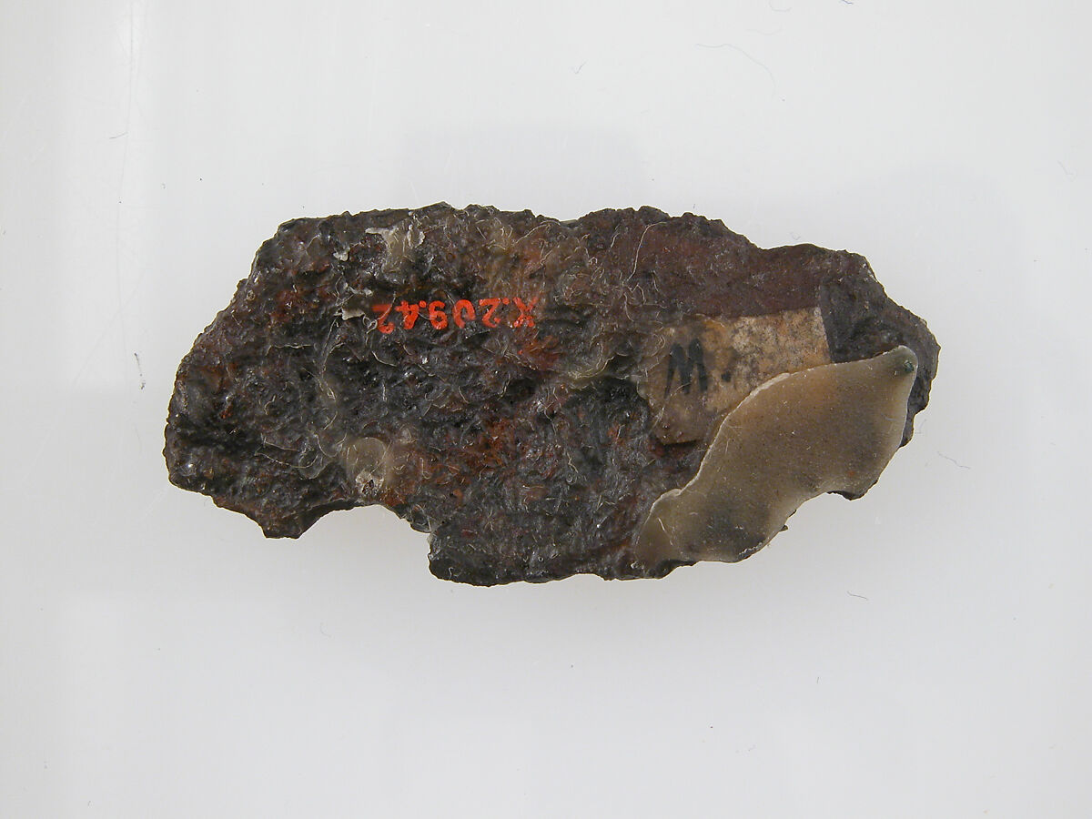 Plate Fragment of a Belt Buckle, Iron, silver and brass inlay, and gilded bronze nail, Frankish
