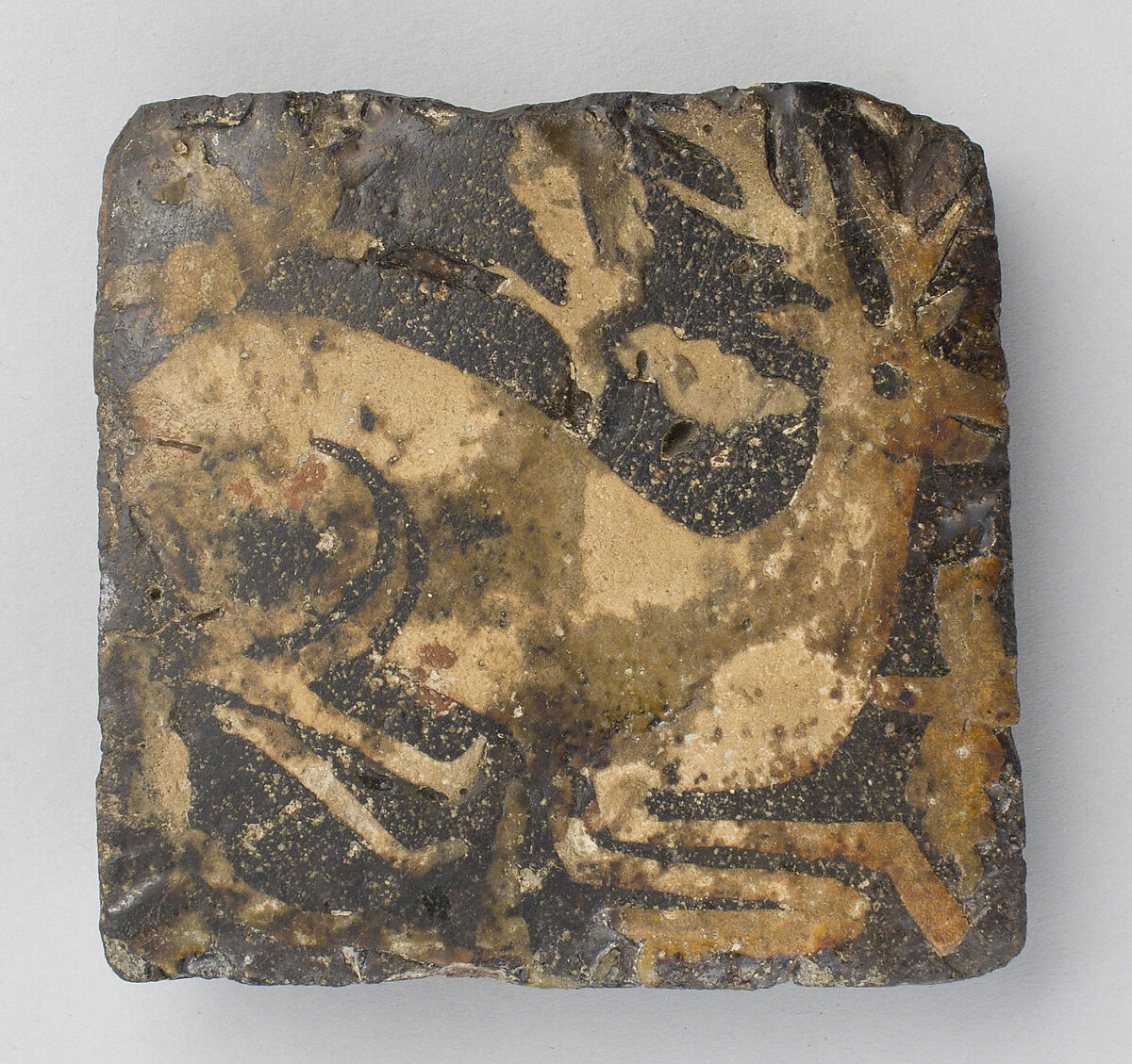 Tile with kneeling hart, Fired earthenware with slip decoration and lead glaze, British 