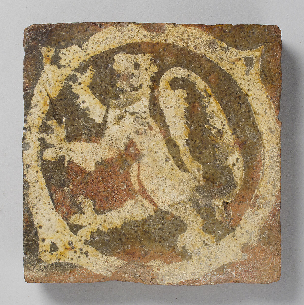 Tile with rampant lion, Fired earthenware, with slip decoration and lead glaze, British 