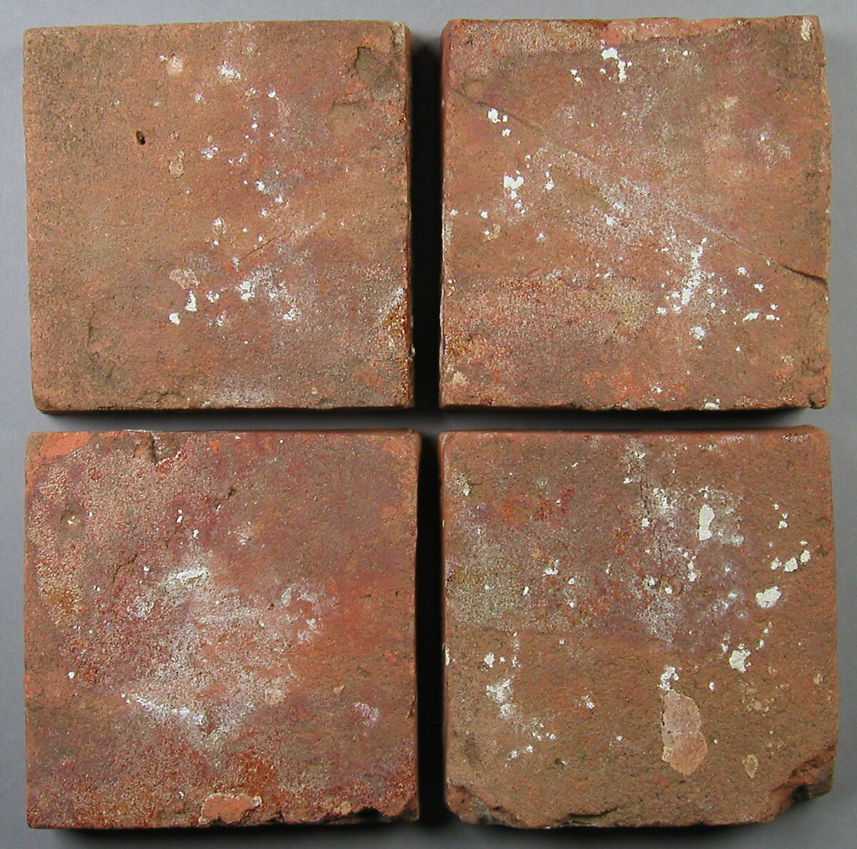 Four Two-Colored Tiles, Fired earthenware, with slip decoration and lead glaze, British