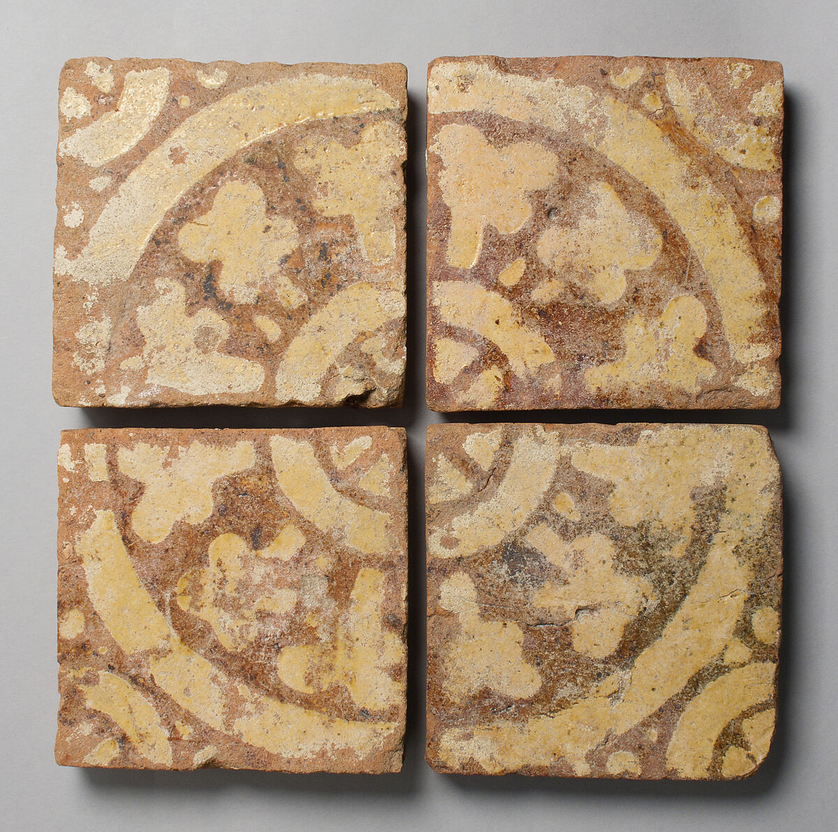 Four Two-Colored Tiles, Fired earthenware, with slip decoration and lead glaze, British 