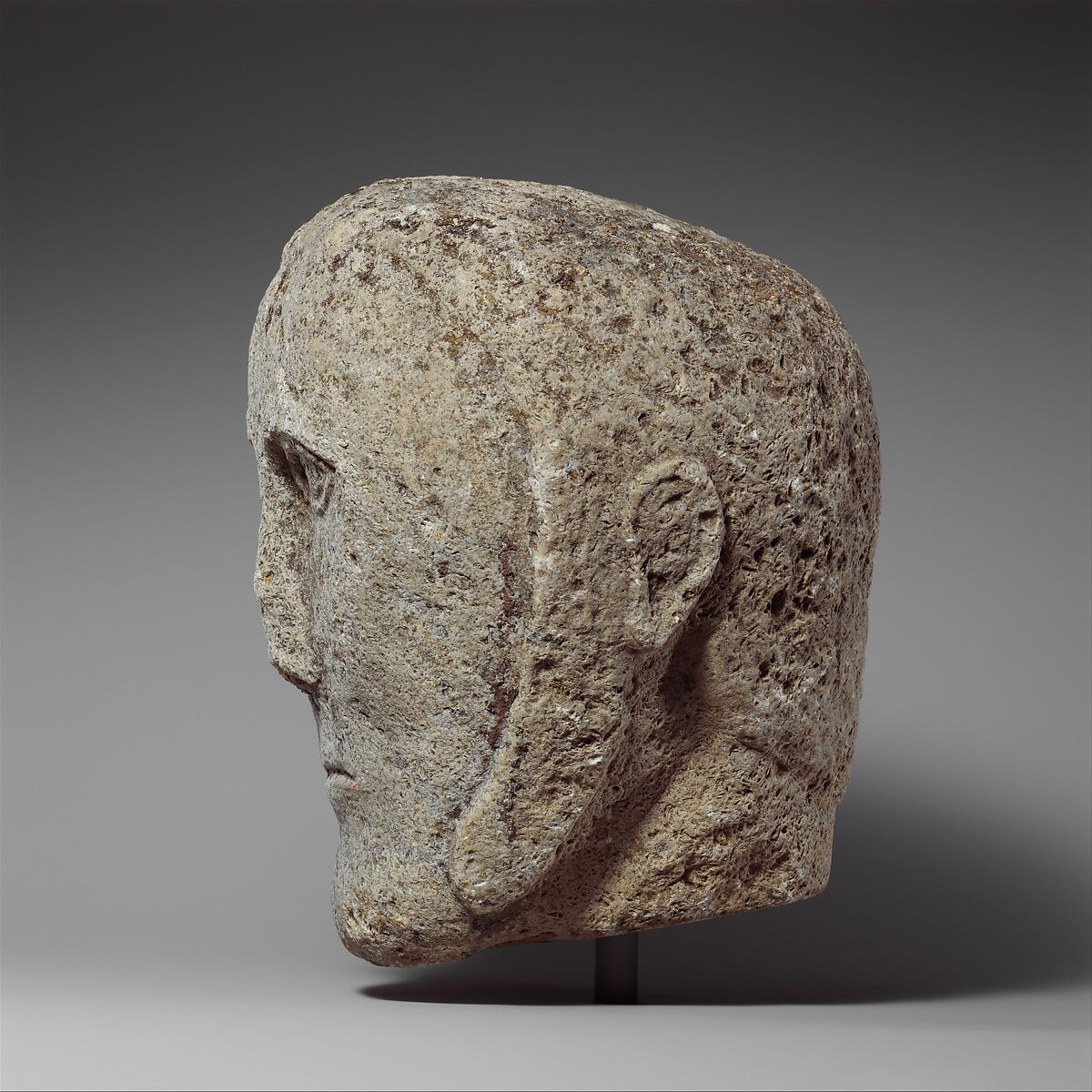Head of a Man Wearing a Cap or Helmet, Fossiliferous limestone, Celtic