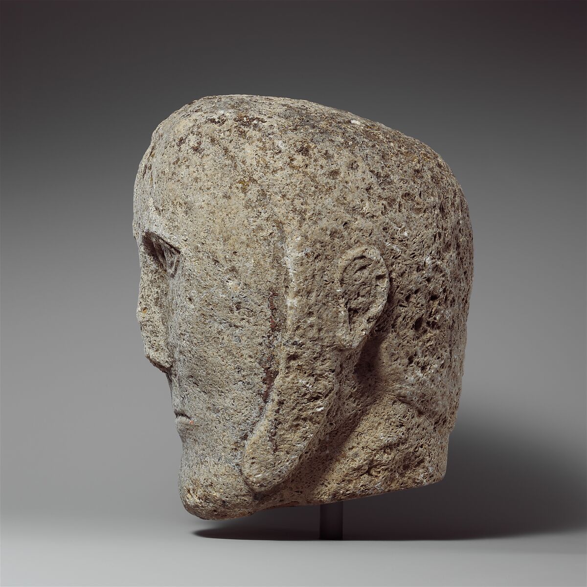 Head of a Man Wearing a Cap or Helmet, Fossiliferous limestone, Celtic