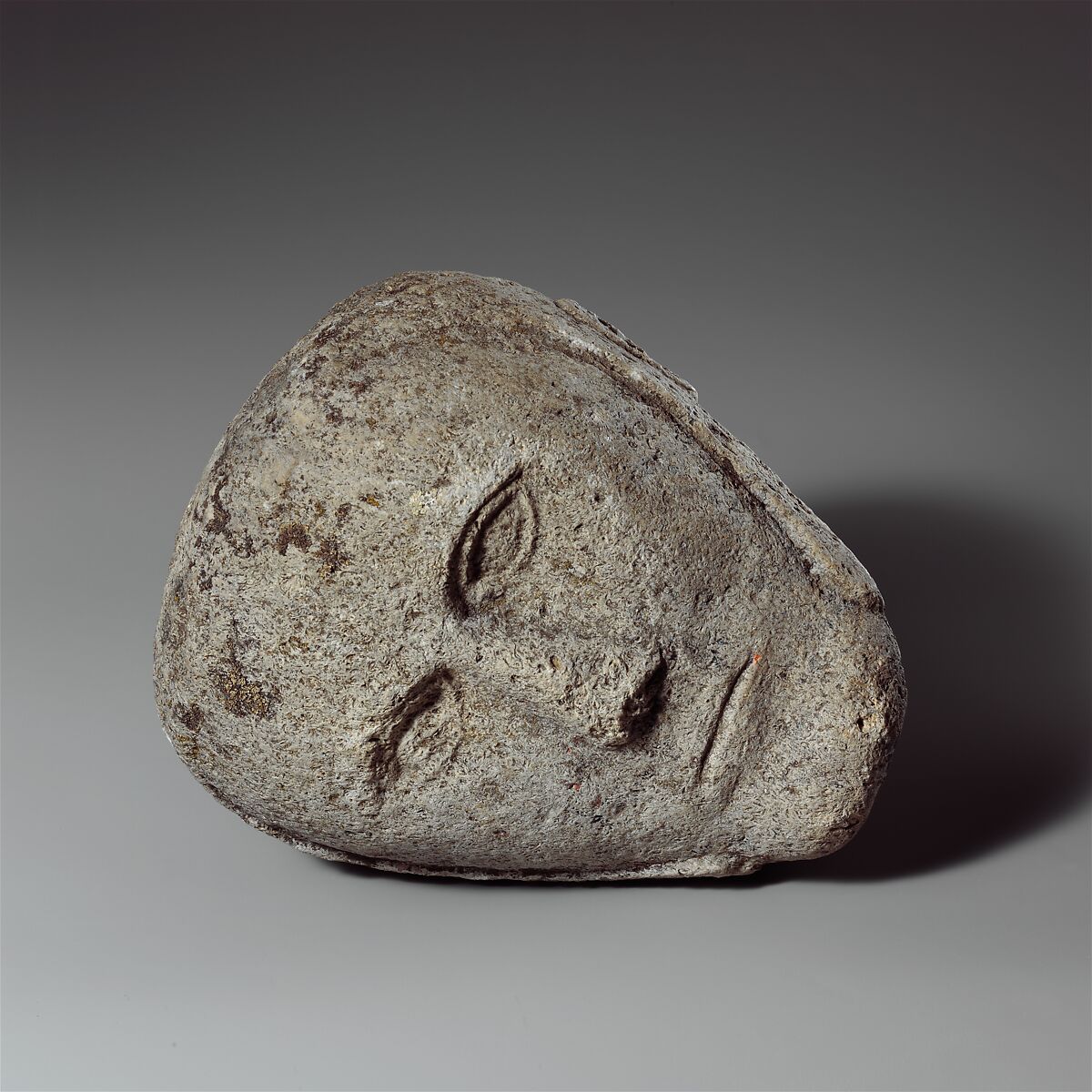 Head of a Man Wearing a Cap or Helmet, Fossiliferous limestone, Celtic