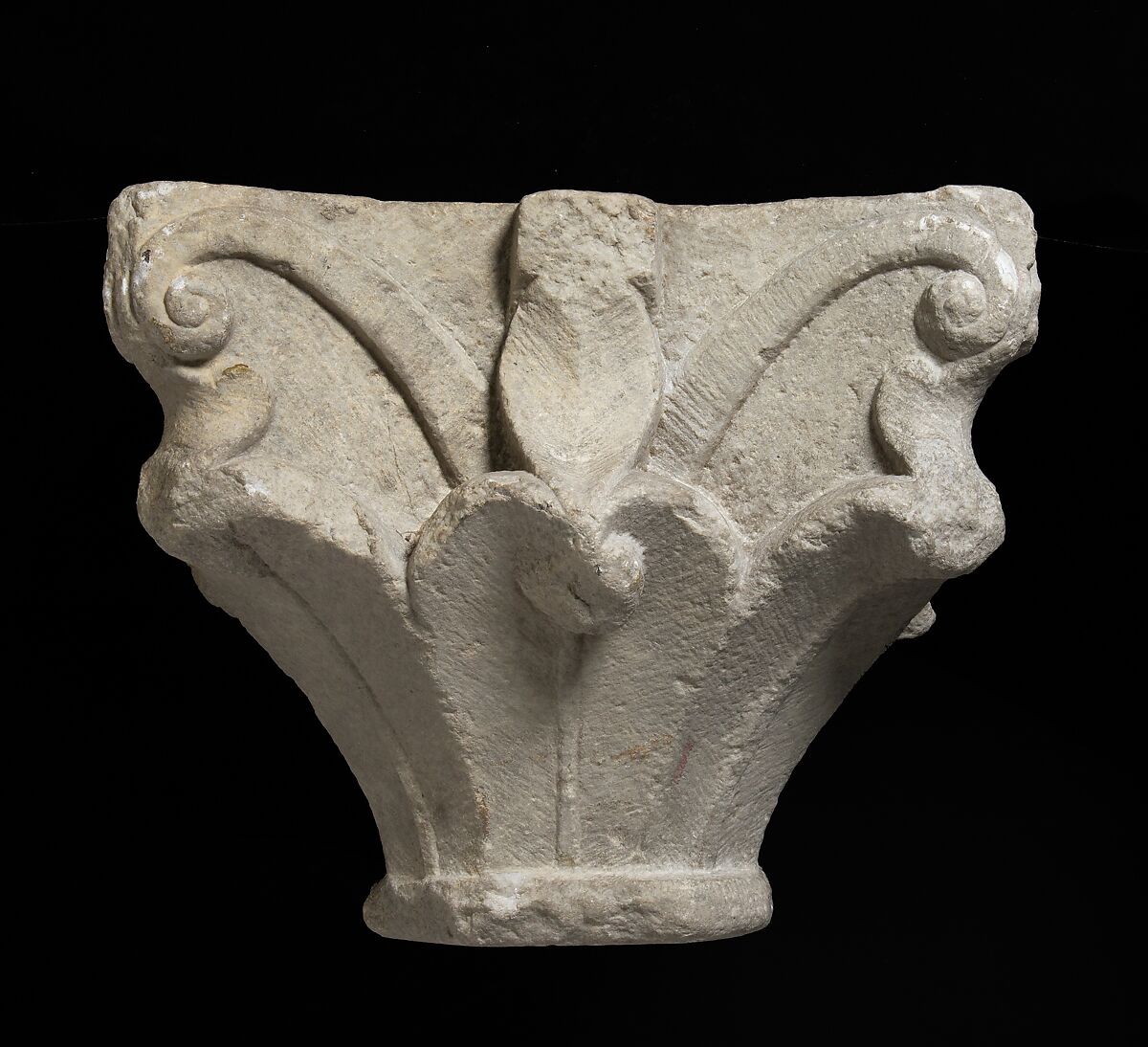 Capital, Stone; carved in relief; leaf forms and volutes.  Chipped., Catalan 