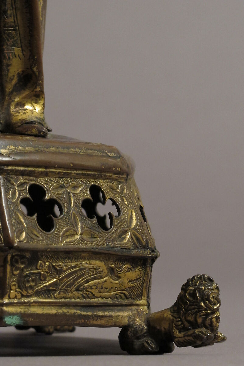 Priest holding a Reliquary, Copper gilt; reliquary vessel: silver, champleve enamel, glass, textile wrapped relic, North French