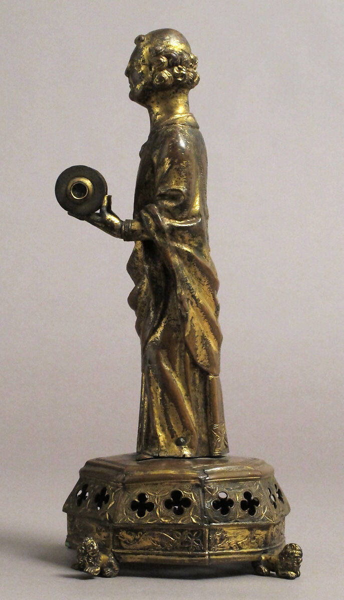 Priest holding a Reliquary, Copper gilt; reliquary vessel: silver, champleve enamel, glass, textile wrapped relic, North French