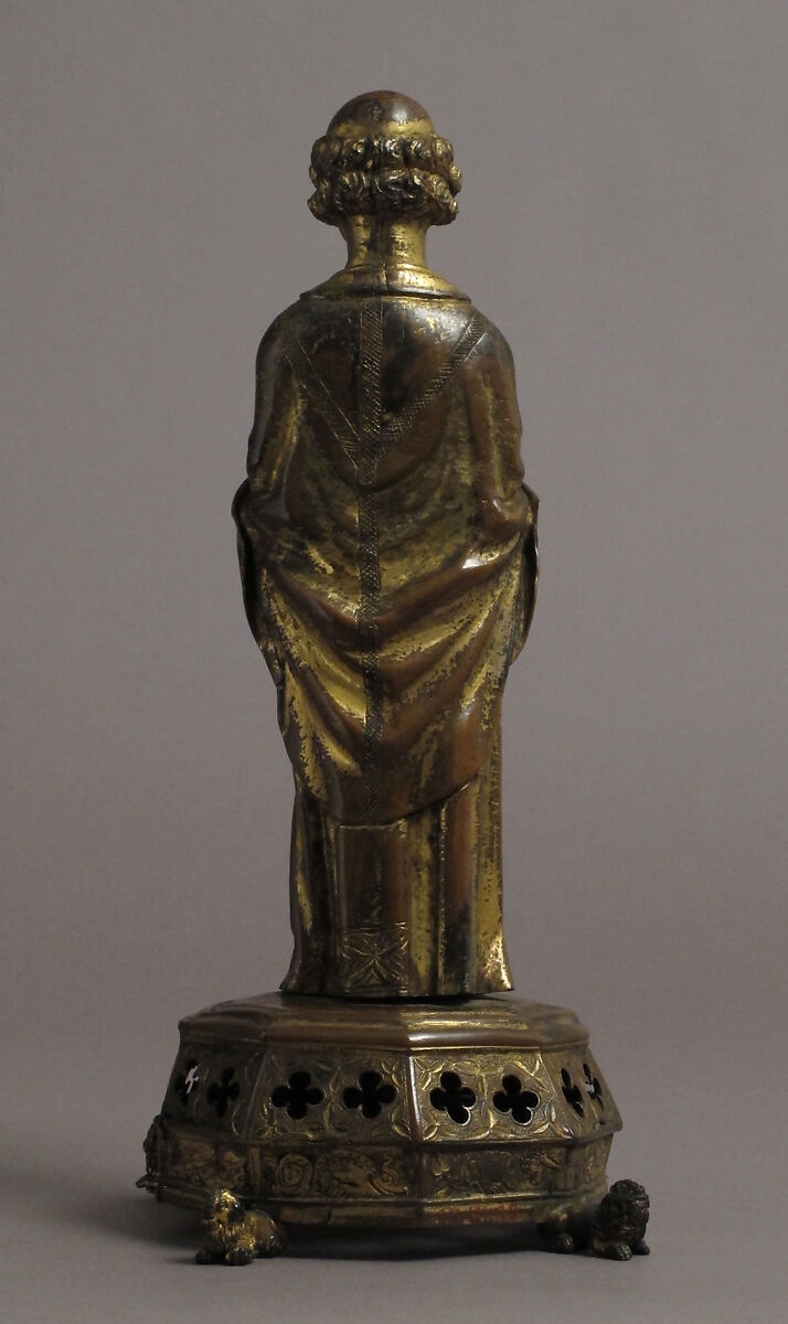 Priest holding a Reliquary, Copper gilt; reliquary vessel: silver, champleve enamel, glass, textile wrapped relic, North French