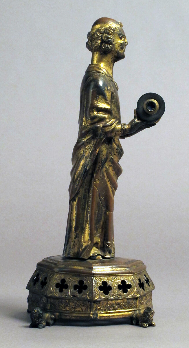 Priest holding a Reliquary, Copper gilt; reliquary vessel: silver, champleve enamel, glass, textile wrapped relic, North French