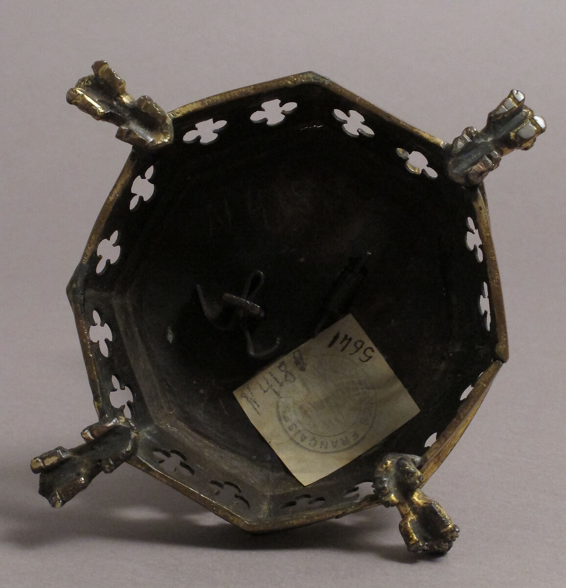 Priest holding a Reliquary, Copper gilt; reliquary vessel: silver, champleve enamel, glass, textile wrapped relic, North French