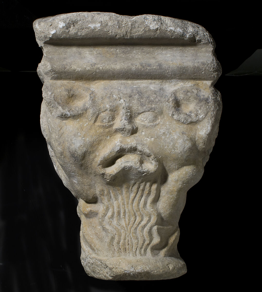 Double Capital, Limestone or sandstone, French