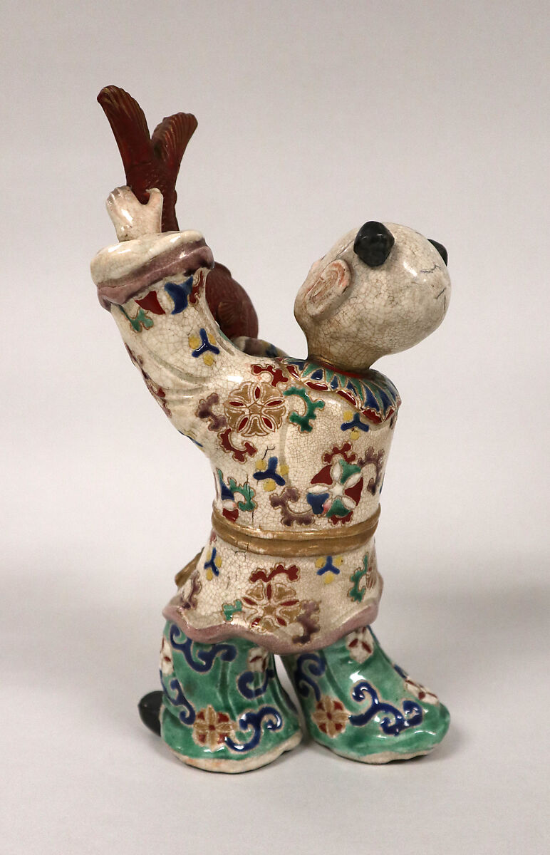 Boy Holding up a Carp, Faience decorated in colored enamels and gold (Satsuma ware), Japan