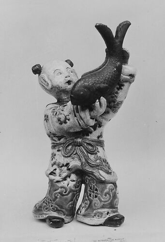 Boy Holding up a Carp