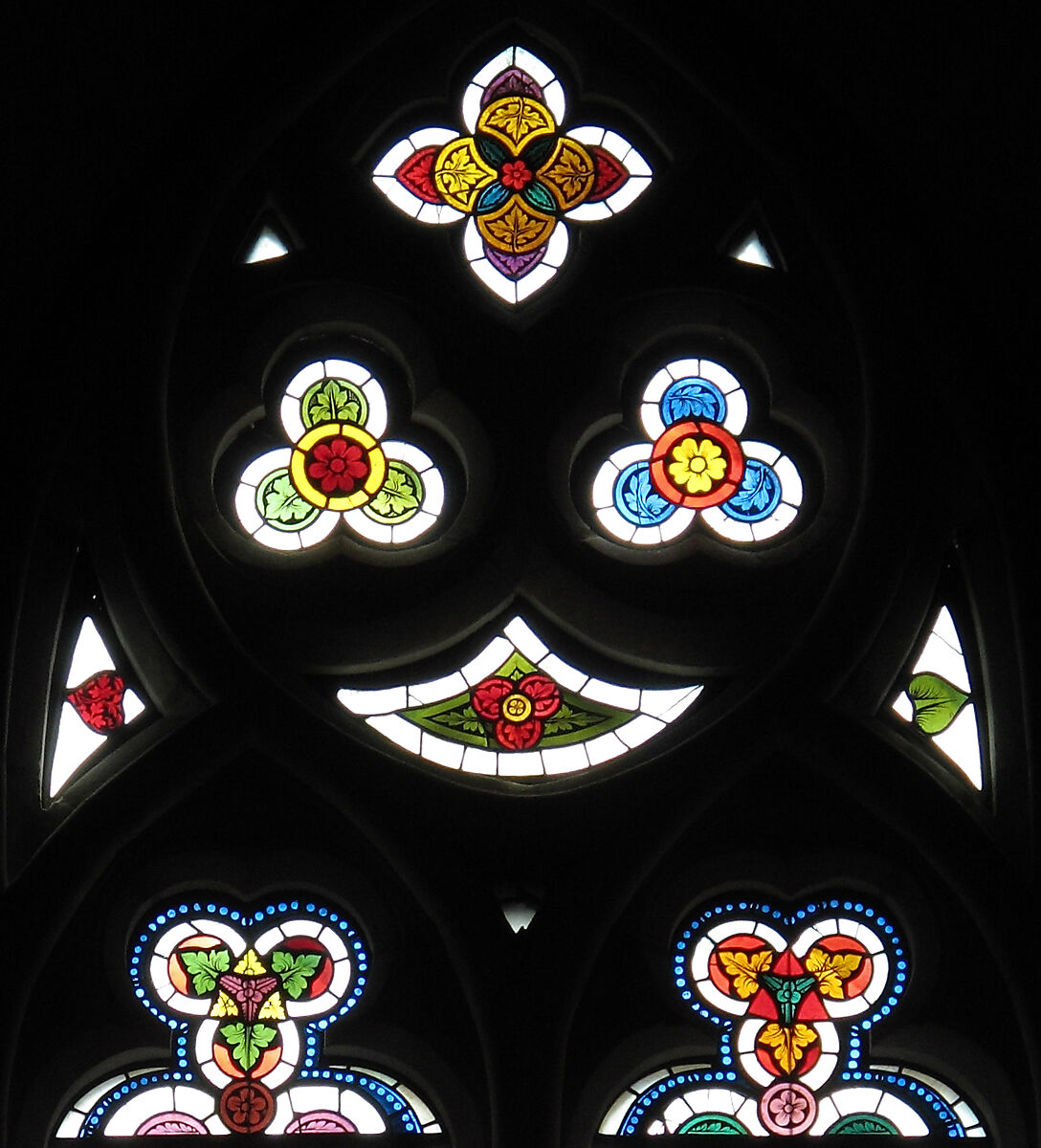 Triangular-shaped Tracery Light, Pot-metal and colorless glass with vitreous paint, Austrian