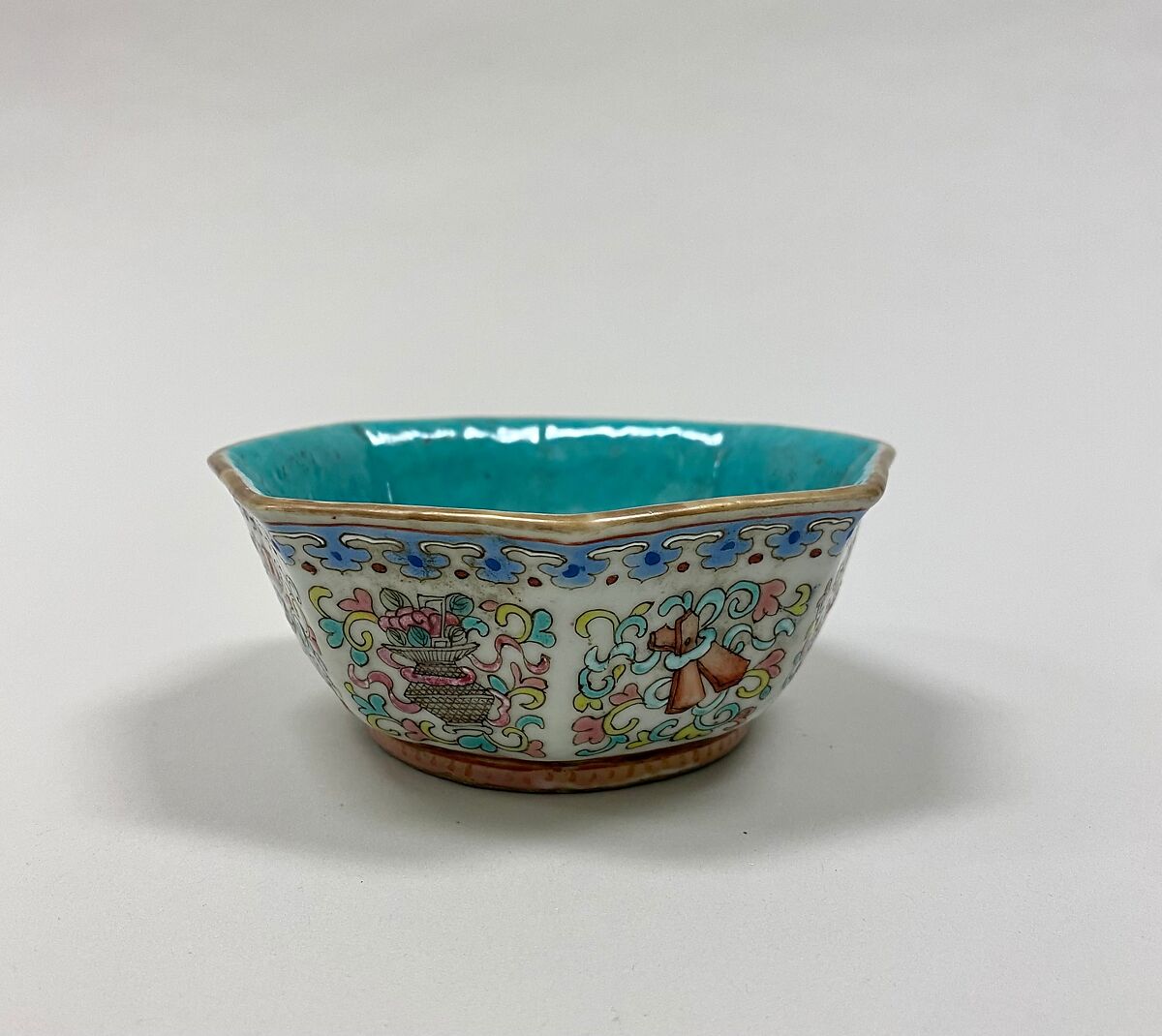 Octagonal bowl with symbols of the Eight Immortals, Porcelain painted in overglaze polychrome enamels, turqoise green glaze inside (Jingdezhen ware), China 