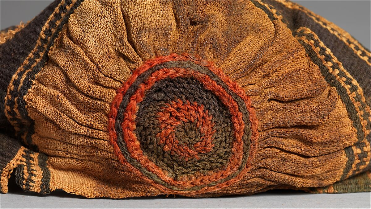 Extended Cap, Linen, wool: Tapestry weave in polychrome wool and undyed linen on plain-weave ground in undyed linen; crown decoration in looping technique in polychrome wool; row of stiches below wide band in nearly black wool, red wool, and undyed linen ending in plied threads, Coptic