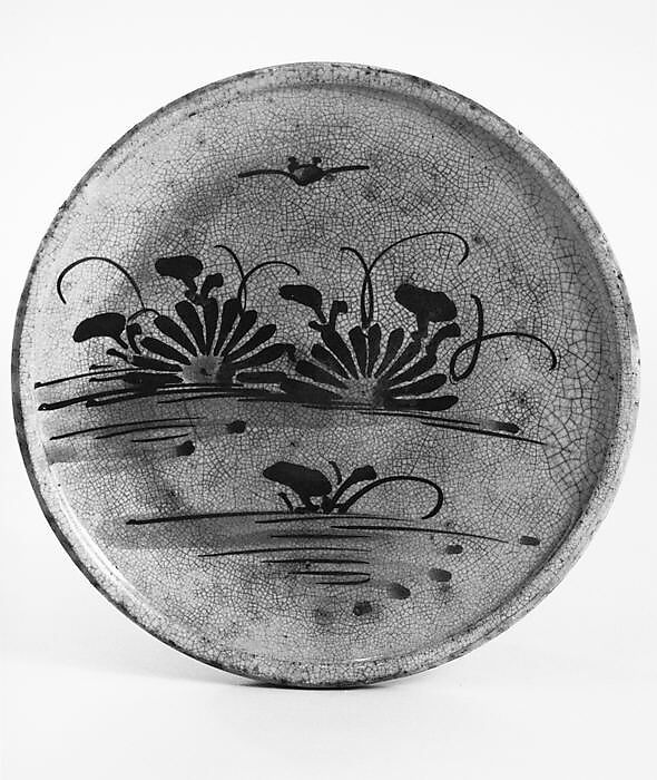 Plate, Pottery; flat with raised rim; design of chrysanthemums and butterfly painted in iron pigment on face of plate (Seto ware), Japan 