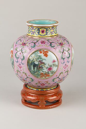 Vase on stand with openwork pattern of flowers