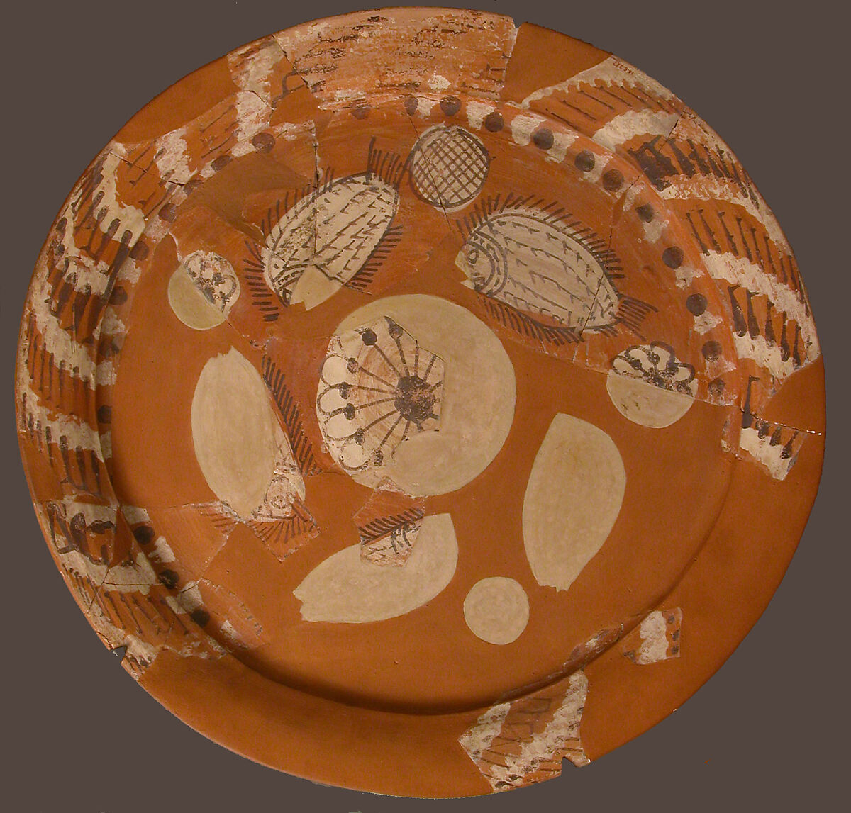 Fragmentary Platter with Fish and Rosettes, Terracotta decorated with red, white and dark brown slip, Coptic 