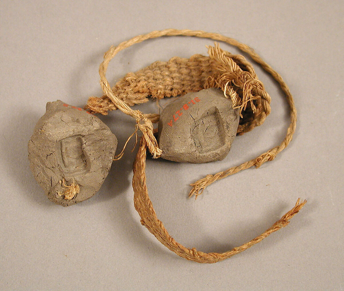 Two Seals, Mud, with textile bands, Coptic 