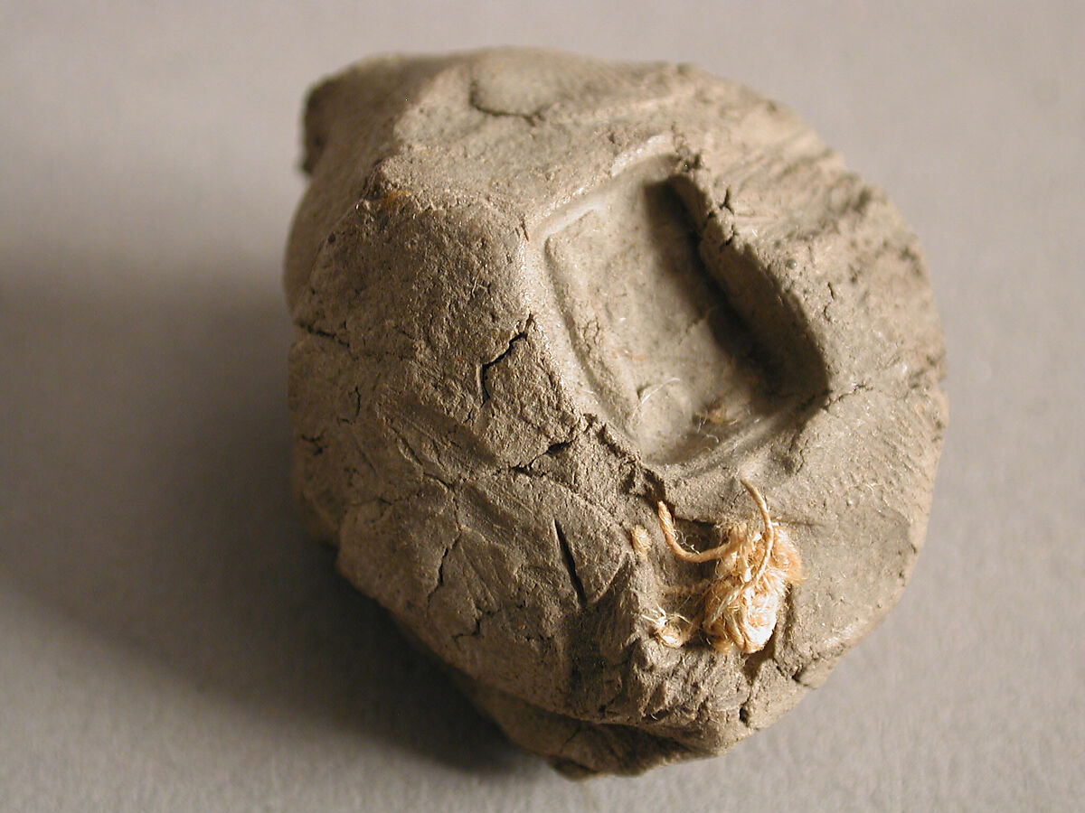 Two Seals, Mud, with textile bands, Coptic
