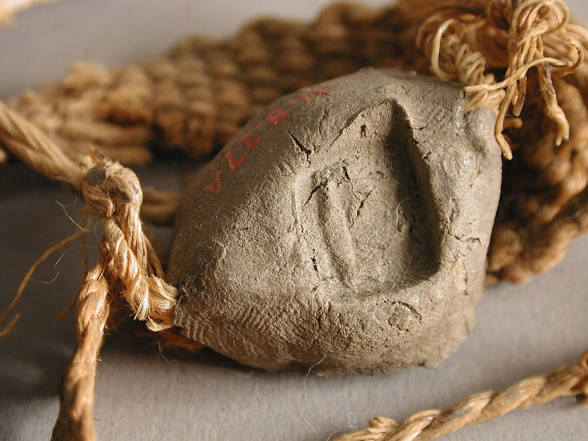 Two Seals, Mud, with textile bands, Coptic