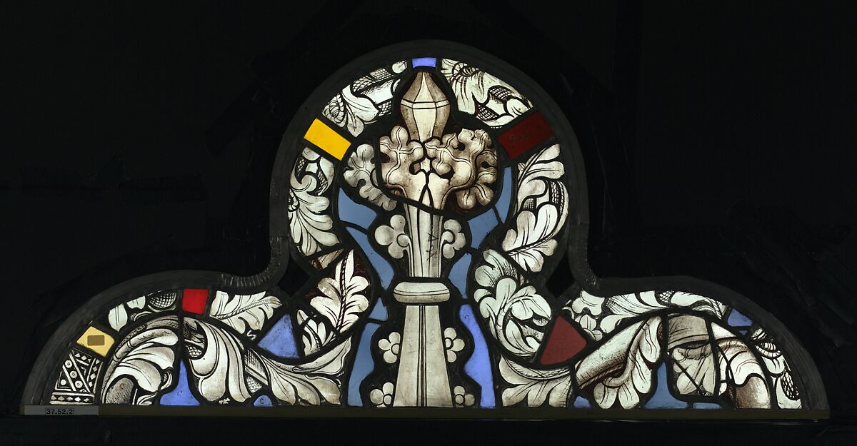 The Virgin in a Blue Robe Decorated with Images of Wheat, with the Arms of the Bishop of Liège below (from a series with The Virgin Mary and Five Standing Saints), Pot-metal glass, white glass, vitreous paint, silver stain, German