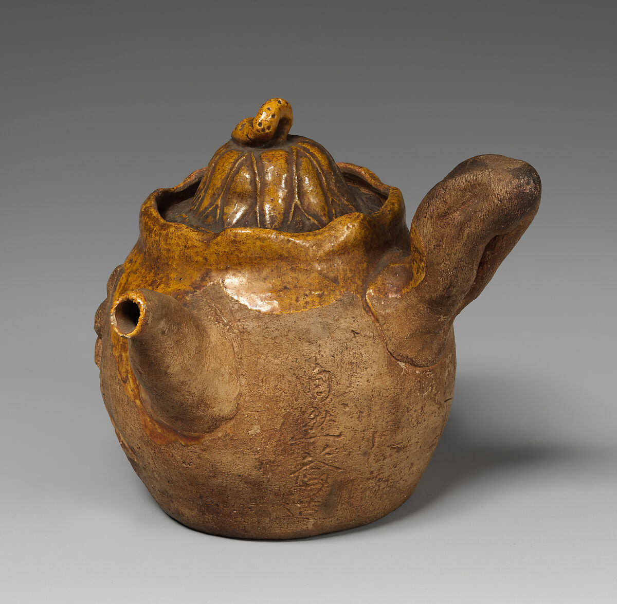 Teapot, Pottery moulded, partly covered with glaze, Japan