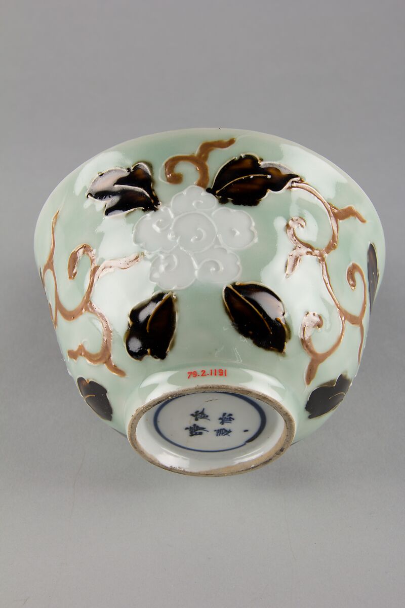 Bowl with dragon and floral pattern, Porcelain painted in underglaze cobalt blue, with relief decoration, and celadon and dark brown glazes, China