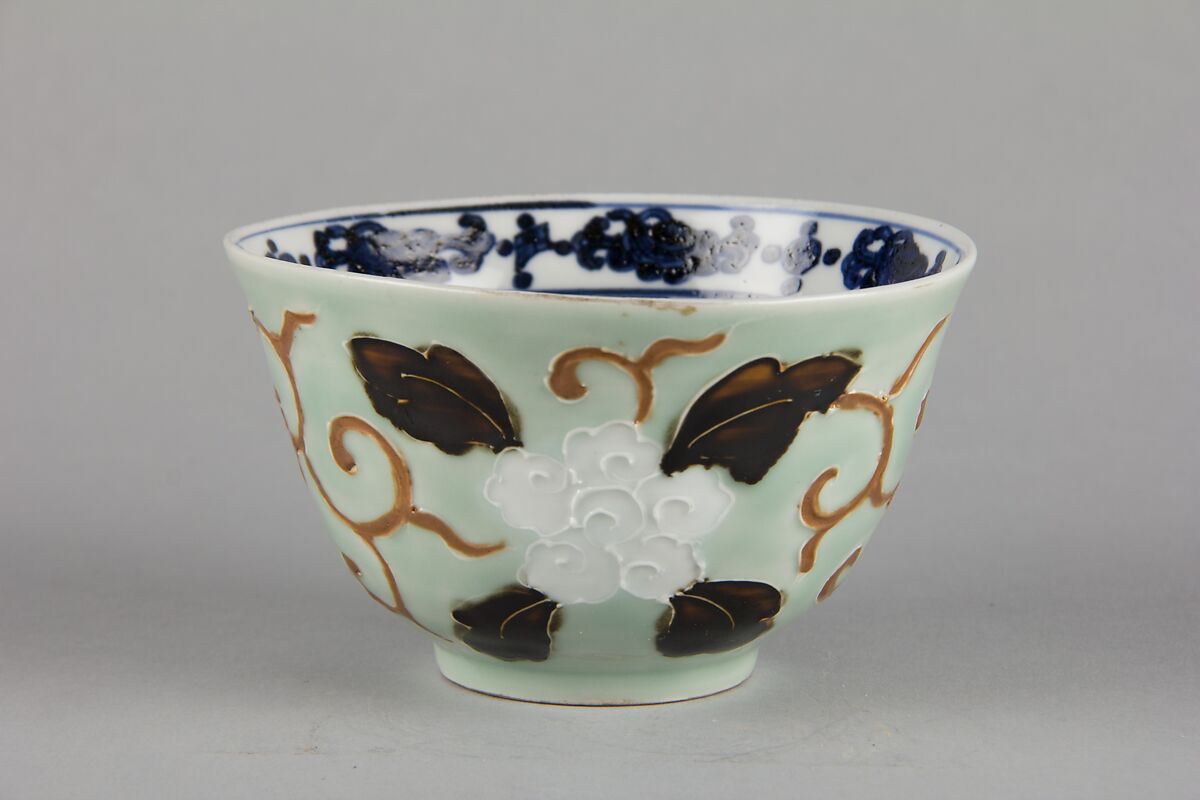 Bowl with dragon and floral pattern, Porcelain painted in underglaze cobalt blue, with relief decoration, and celadon and dark brown glazes, China 