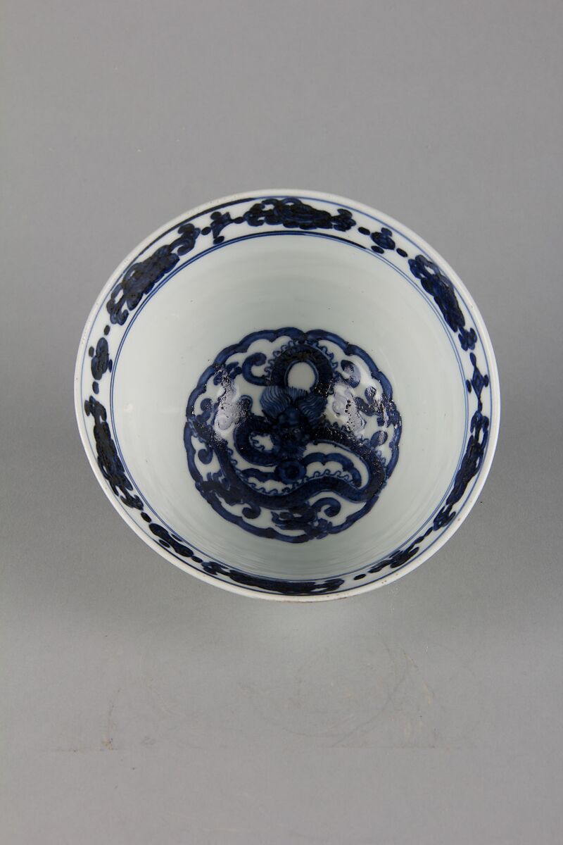 Bowl with dragon and floral pattern, Porcelain painted in underglaze cobalt blue, with relief decoration, and celadon and dark brown glazes, China