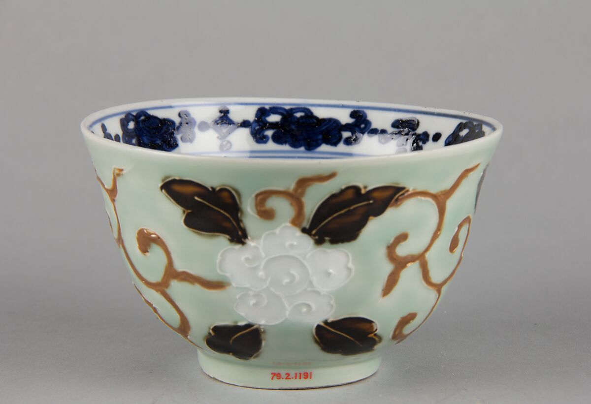 Bowl with dragon and floral pattern, Porcelain painted in underglaze cobalt blue, with relief decoration, and celadon and dark brown glazes, China