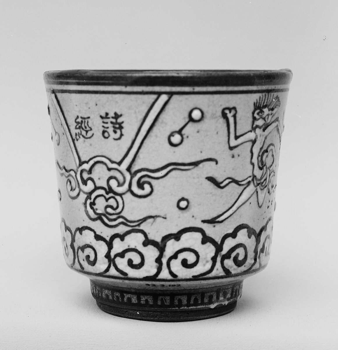 Cup, Buff ware decorated with white slip, black lines and covered with a transparent crackled glaze (Kyoto ware), Japan 