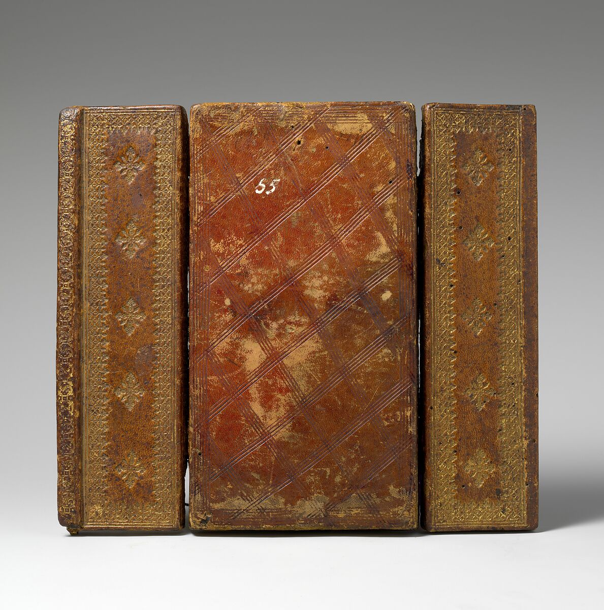 Triptych with the Passion of Christ, Mother-of-pearl, gilt wood frame, silk backing, and tooled leather covering, South German