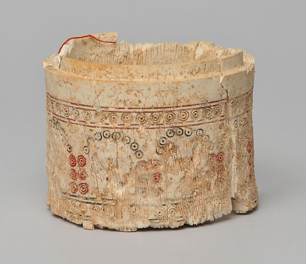 Pyxis, Ivory, carved, incised, and infilled with red and black pigments 