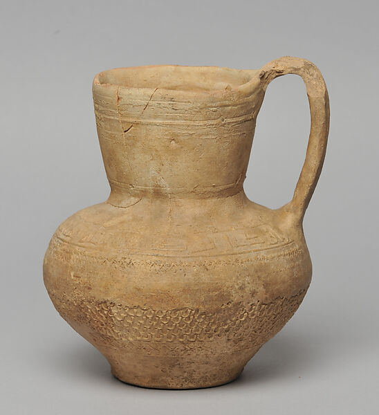 Jug from Dayr 'Ayn 'Abata, Cream ware with roll-on stamp decoration 