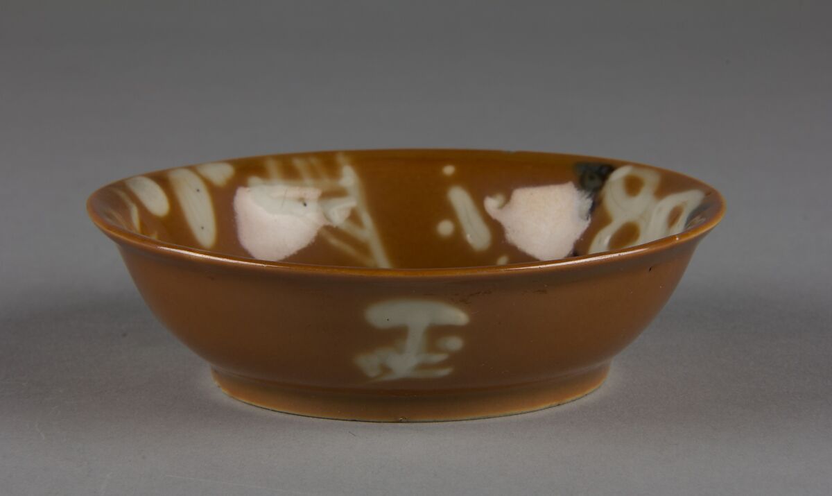 Dish with mythical beast qilin (one of a pair), Porcelain with white slip decoration and brown glaze (Jingdezhen ware), China