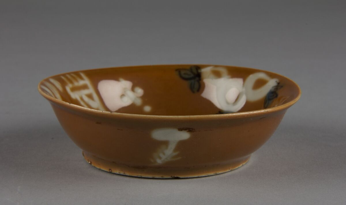 Dish with mythical beast qilin (one of a pair), Porcelain with white slip decoration and brown glaze (Jingdezhen ware), China