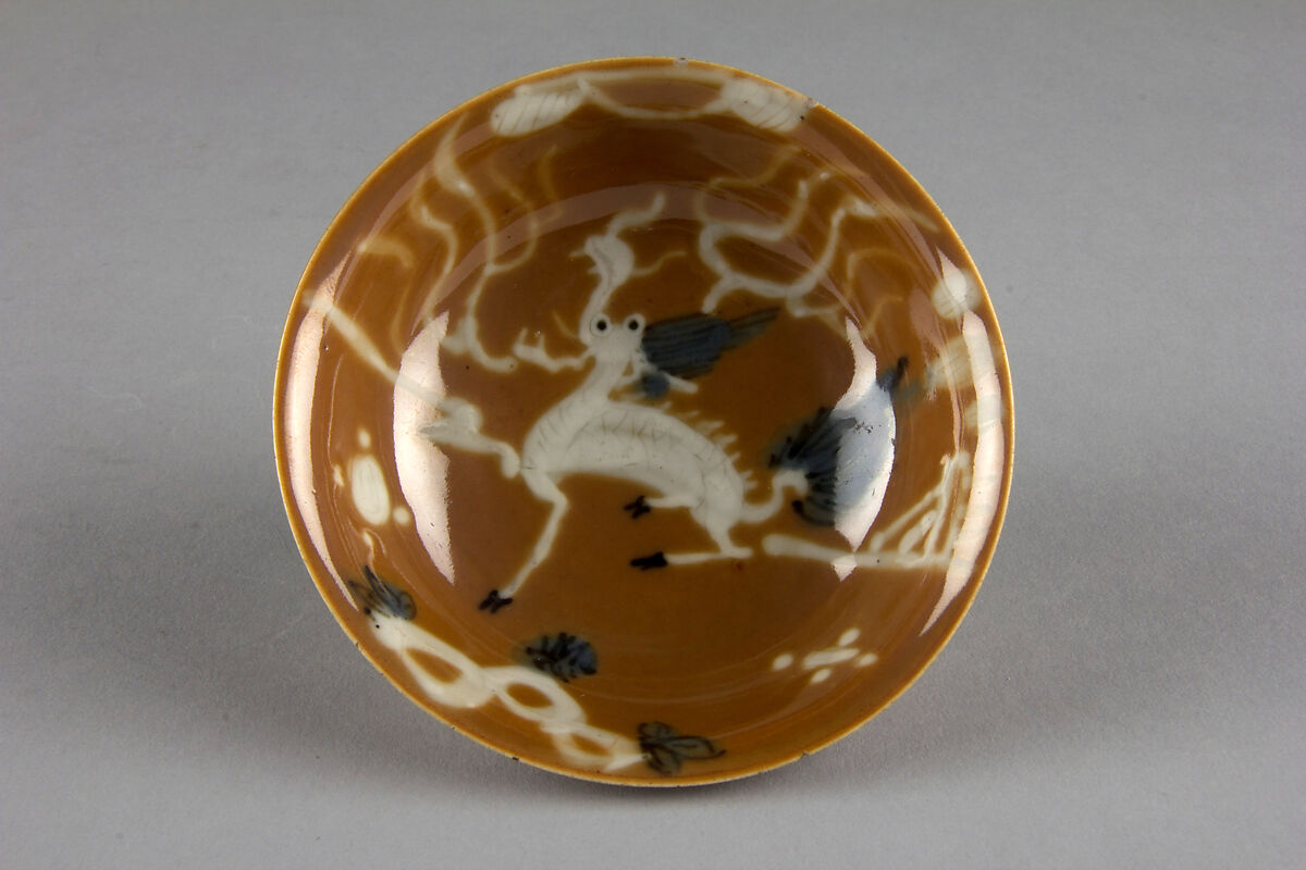 Dish with mythical beast qilin (one of a pair), Porcelain with white slip decoration and brown glaze (Jingdezhen ware), China 