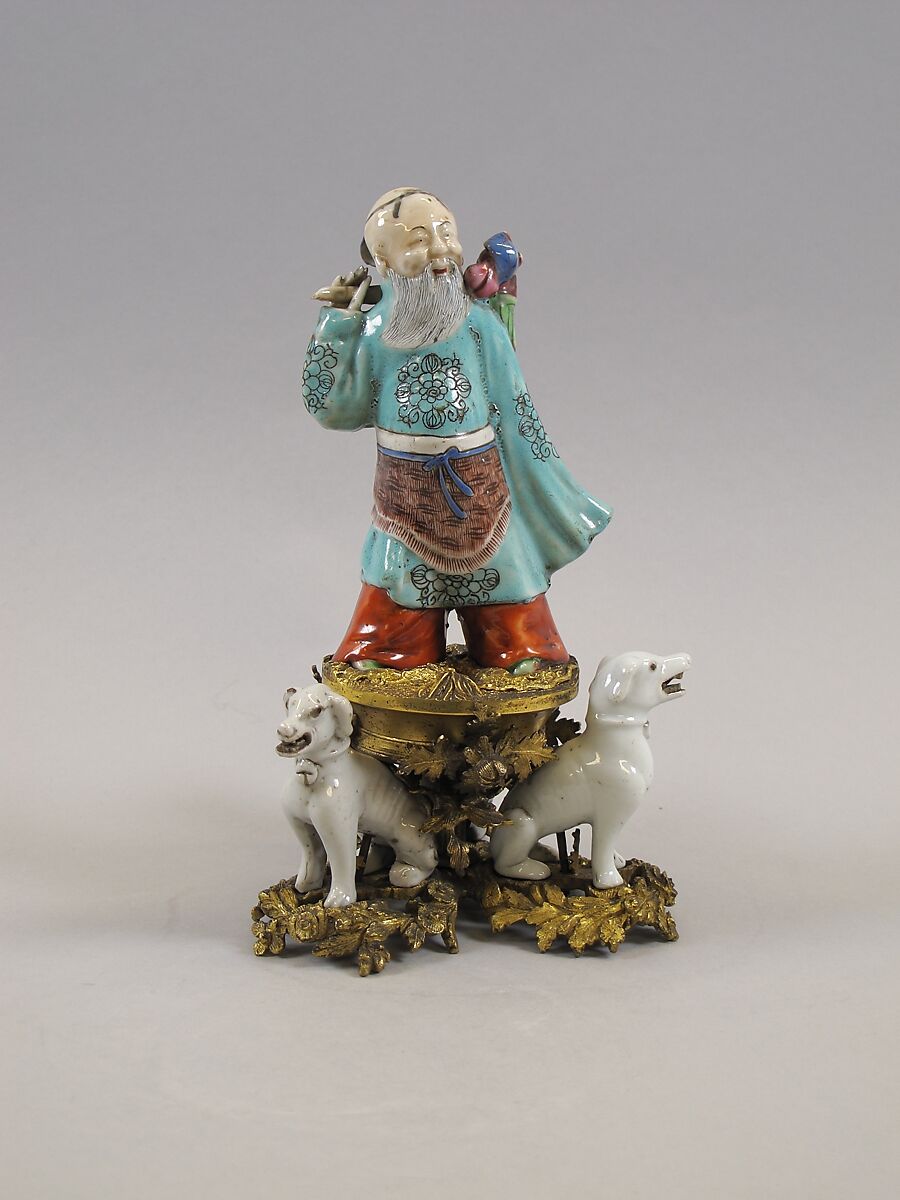 Figure of God of Longevity (Shoulao) and two dogs, Porcelain painted in overglaze polychrome enamels (Jingdezhen ware), European gilt bronze mount, China 