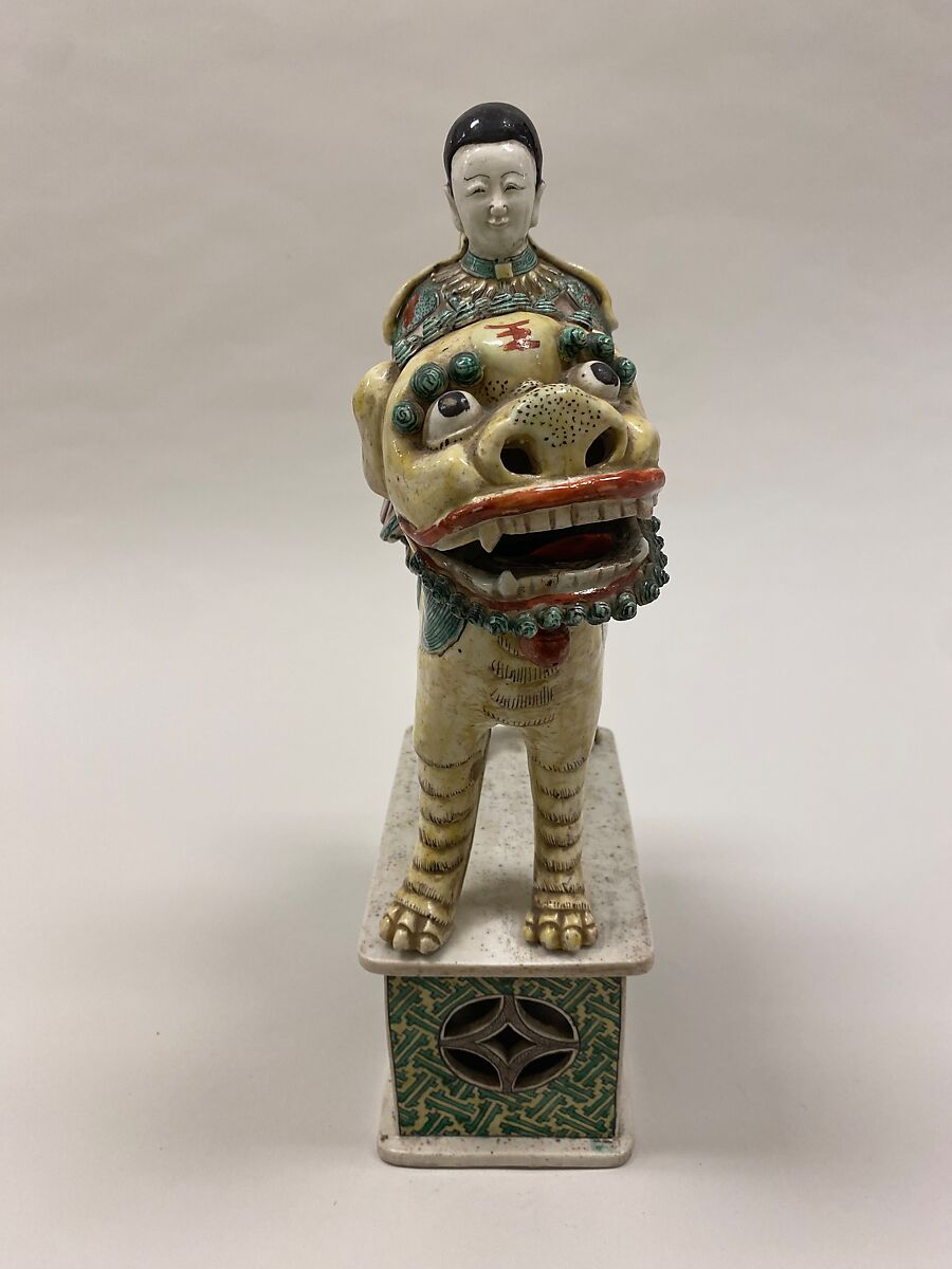 Figure of Bodhisattva Guanyin riding a lion, Porcelain painted in polychrome enamels over the biscuit (Jingdezhen ware), China