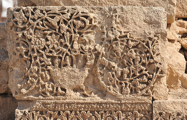 Fragment Carved with Vine Scroll and a Vase, Limestone, carved 