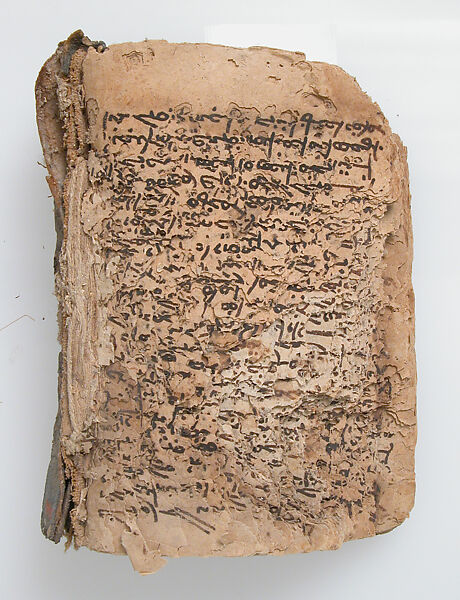Remains of a Manuscript, Ink on paper; leather binding, Syriac