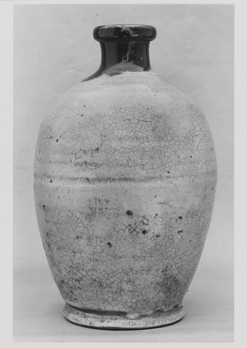 Wine Bottle, Clay covered with white slip and a crackled transparent glaze; darker glaze around the neck (Agano ware), Japan 