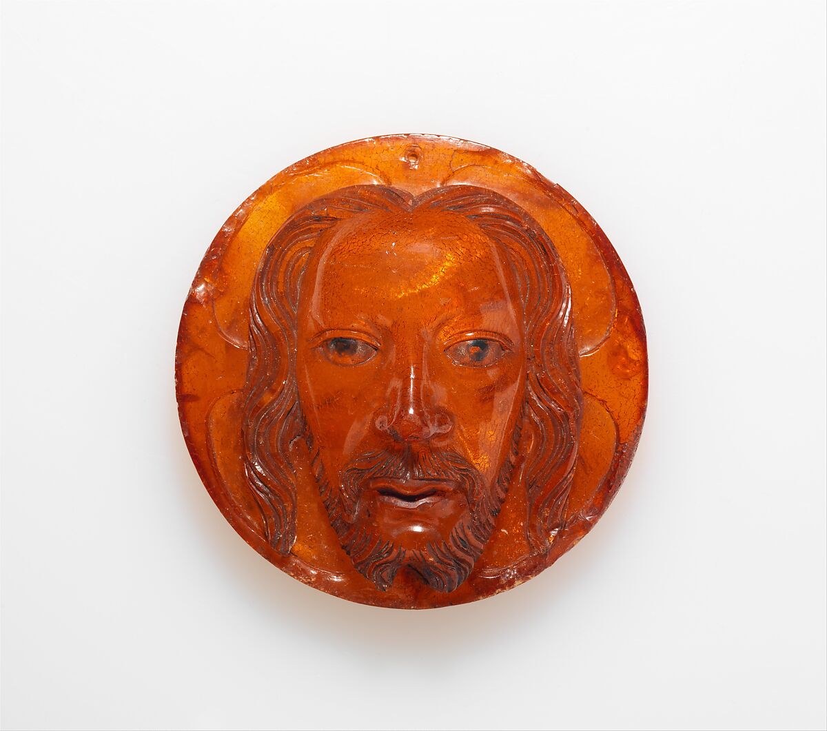 Medallion with the Face of Christ, Baltic amber with traces of paint, Polish 