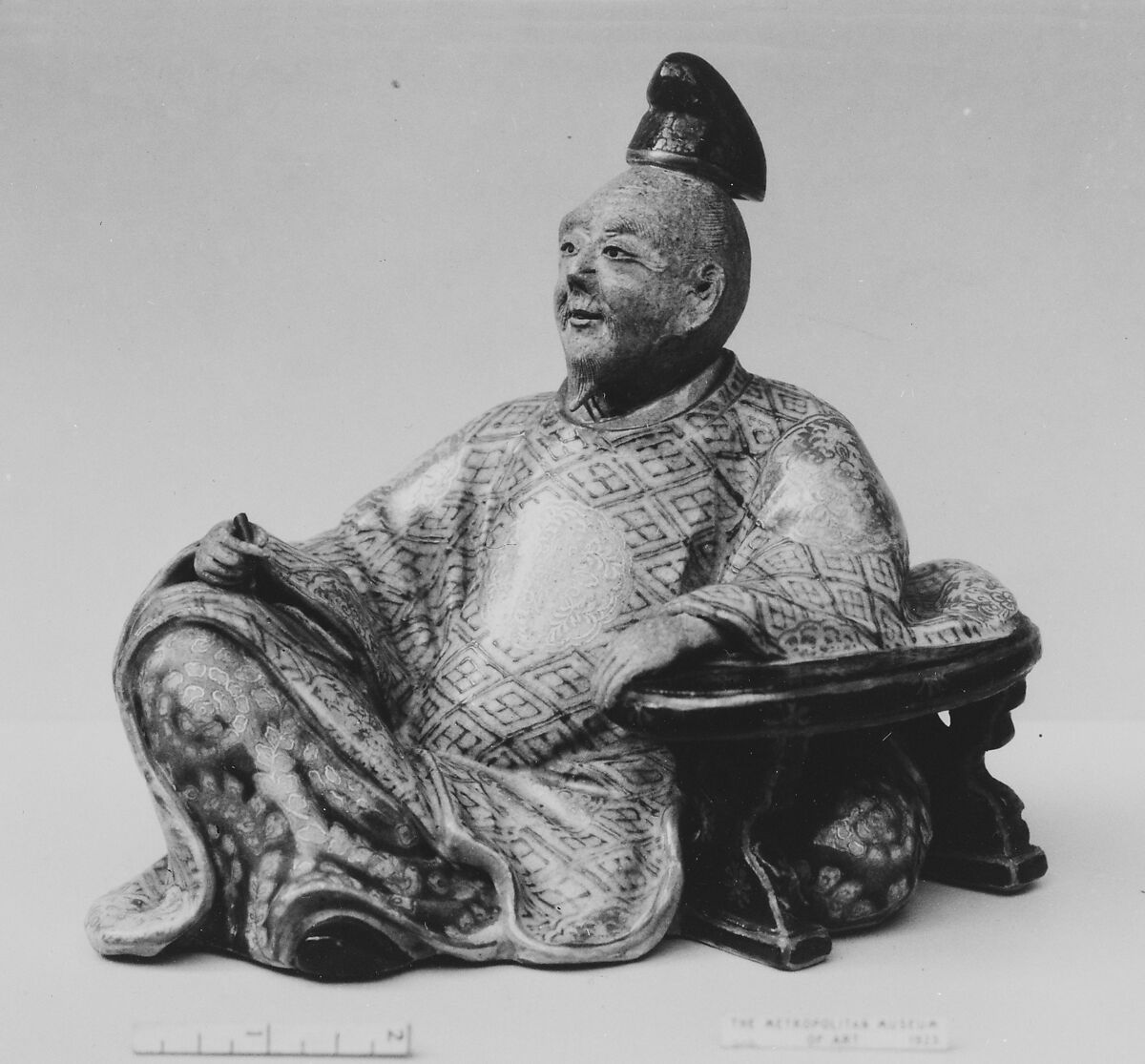 Ornament In form of Poet, Hitomaru, Faience, the face and hands unglazed; the rest of the figure decorated in polychrome and gold (Kiyomizu ware), Japan 