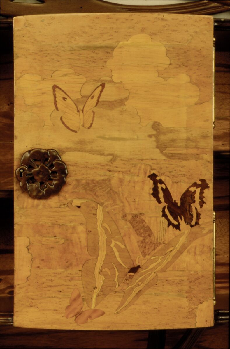 "Ombellifères" (cow parsley) Cabinet, Emile Gallé (French, Nancy 1846–1904 Nancy), Case and carved elements: Beech (stained)   
Back: Plywood (veneered with Zebrano) 
Veneer on Door: Different types of Maple (maple-curly, tiger-maple, maple-quilted, birds eye), European Chestnut, Satinwood, Walnut