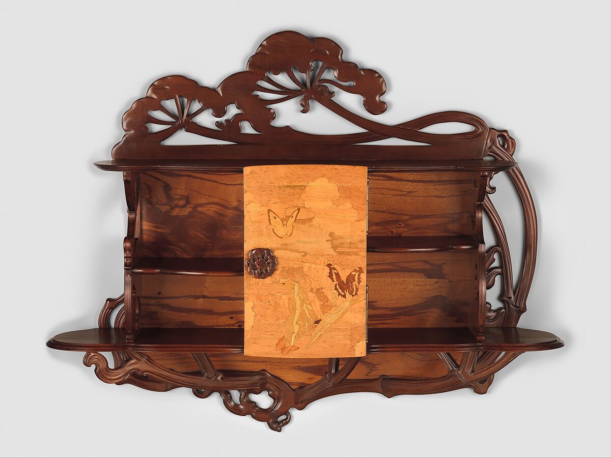 "Ombellifères" (cow parsley) Cabinet, Emile Gallé (French, Nancy 1846–1904 Nancy), Case and carved elements: Beech (stained)   
Back: Plywood (veneered with Zebrano) 
Veneer on Door: Different types of Maple (maple-curly, tiger-maple, maple-quilted, birds eye), European Chestnut, Satinwood, Walnut 