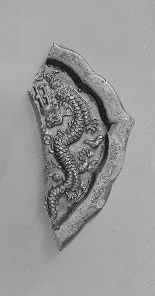 Roof tile fragment with dragon, Earthenware with yellow glaze, China 