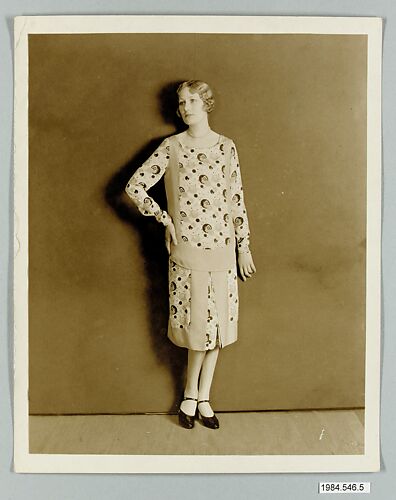 eight 8 x 10 inch black and white photographs of models wearing dresses made from Stehli Silks Americana Print collection.